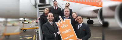 Image of easyJet crew with a large boarding pass to Paris