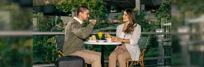 Two people enjoying a coffee in Hamad International Airport