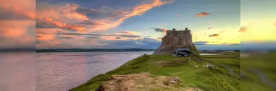 Holy Island (Lindisfarne), which appears in ITV's Vera series and on Shearing's 'Vera's Northumberland Tour: Step into the Drama' tour, near sunset.