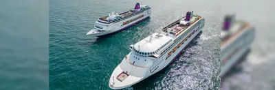 Two Ambassador ships sailing side by side