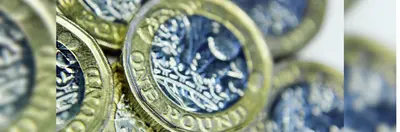 A pile of British £1 coins.