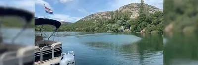 A private boat in the waters of Krka National Park, Croatia