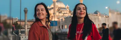 An Intrepid Travel tour guide and guest outside a mosque in Istanbul, Turkey.