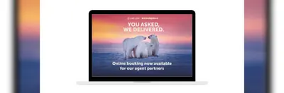 A laptop displaying a promotional banner regarding Just You and Travelsphere's integration into the Sherpa booking platform.