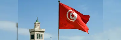 The Tunisian flag waving outside Tunis Town Hall.