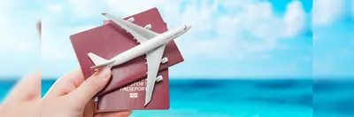 Two passports and a plane replica