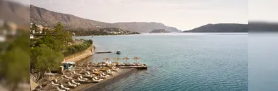 The beachfront area at Domes Aulūs Elounda.