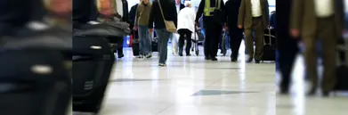 Passengers walking through airport