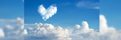 Heart-shaped cloud above sky