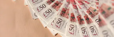 Fanned out £50 notes on a table