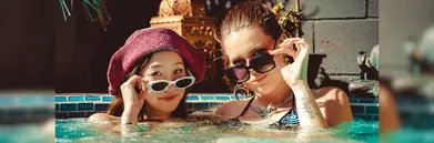 Two women with sunglasses in a hot tub