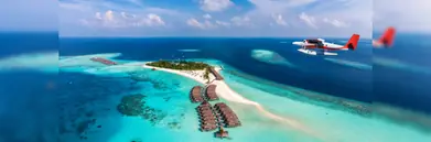 A plane flying over the Maldives