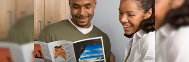 A couple looking at a brochure