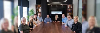 Fareteam team sat around table