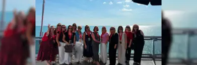 Group of travel agents on ship balcony