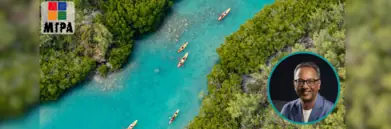 Kayaks on Mauritius river surrounded by trees