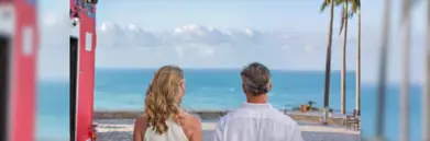 Man and woman looking out to sea