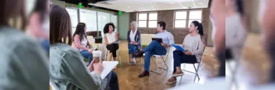 Young committee in circle on chairs having discussion