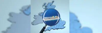 Map of the UK overlaid with a magnifying glass examining a cruise ship