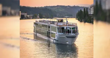 Amadeus vessel sailing in the sunset. 