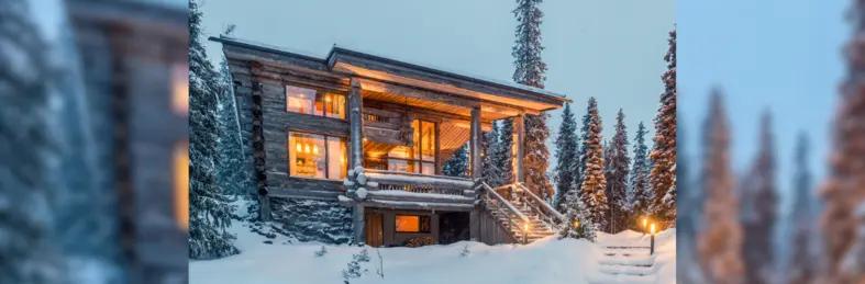 The snow-covered exterior of Villa Lumikukka in the Ruka region of Lapland.
