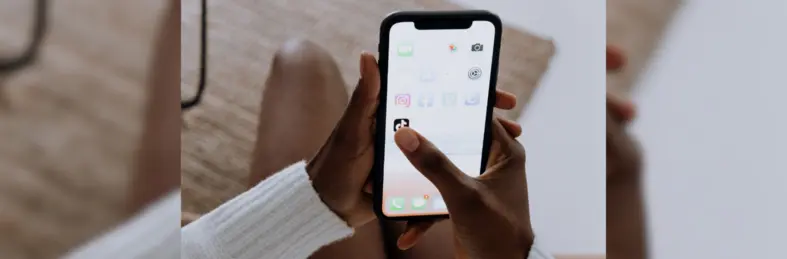 Someone opening the TikTok app on their phone.