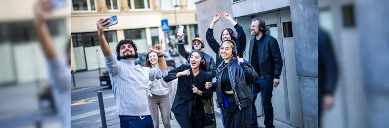 A group of Avani Frankfurt City Hotel guests on a Silent Techno Walking Tour experience in Frankfurt, Germany.