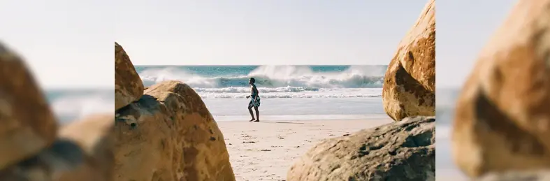 A child on the beach on holiday.