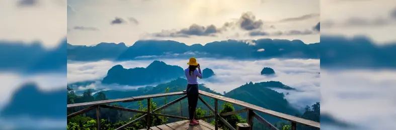 A tourist taking a photo from the Doi Tapang Viewpoint near Chumphon.
