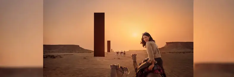 Image of a traveller enjoying a camel ride on an excursion. 