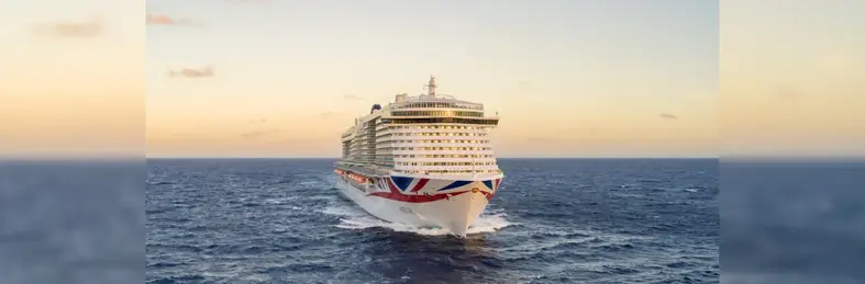 P&O Arvia sailing at sunset.