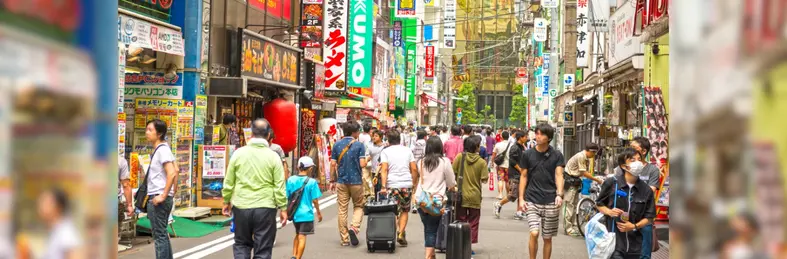 Crowds walking down the streets of the 'Electrical Town' of Akihabara, Tokyo in Japan.