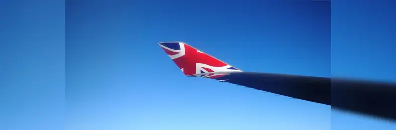 A plane wing in-flight with the Union Flag on it.