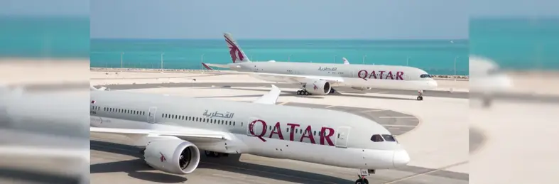 Image of two Qatar Airways planes on the runway