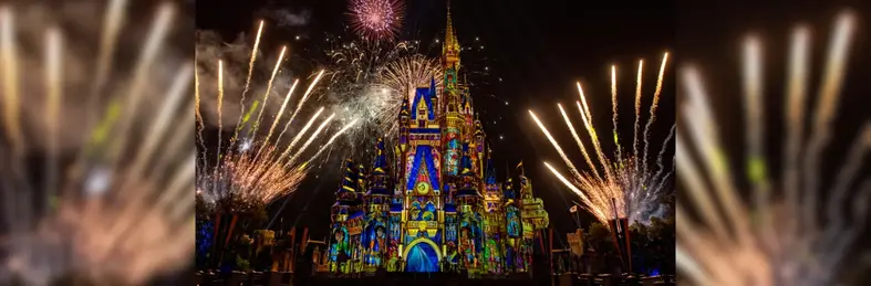 Image of a lit-up Cinderella's Castle at night