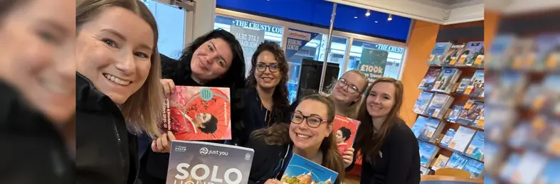 Jasmine Evans, G Touring's key account manager, posing with agents from Hays Travel holding Just You and Travelsphere brochures.