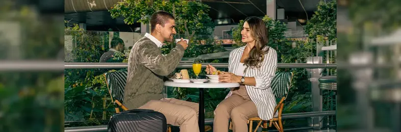Two people enjoying a coffee in Hamad International Airport