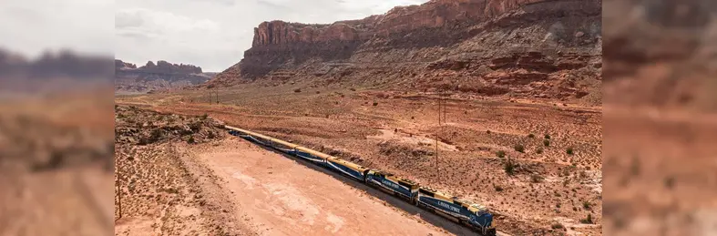 The newly-rebranded Canyon Spirit train driving through a canyon in Utah.