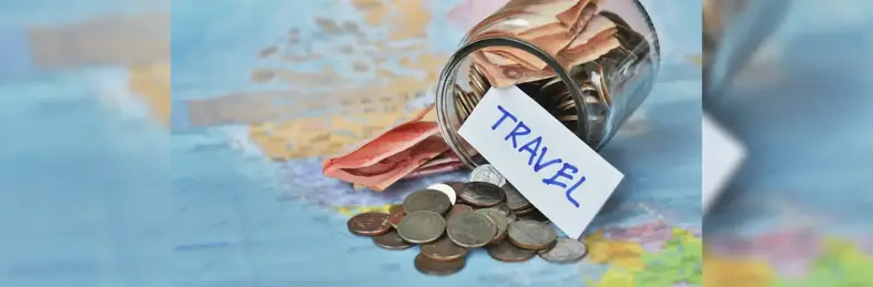 Image of a savings jar full of coins on a map