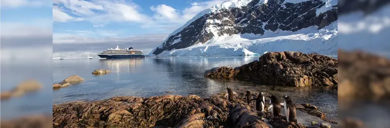 An Atlas Ocean Voyages vessel parked in Antarctica