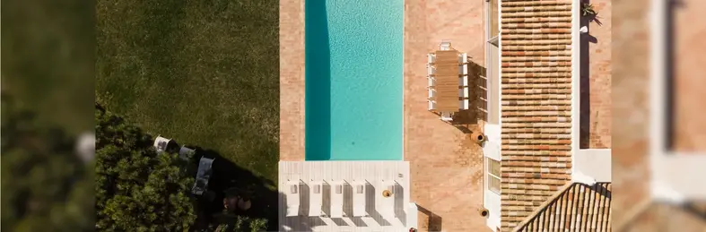 A bird's eye view of the pool deck area at Casa Costa in the Algarve.