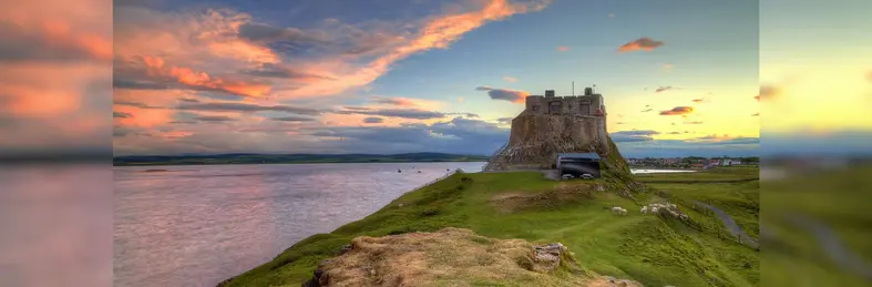 Holy Island (Lindisfarne), which appears in ITV's Vera series and on Shearing's 'Vera's Northumberland Tour: Step into the Drama' tour, near sunset.