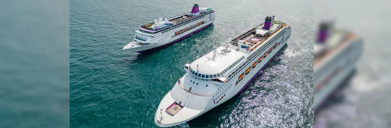 Two Ambassador ships sailing side by side
