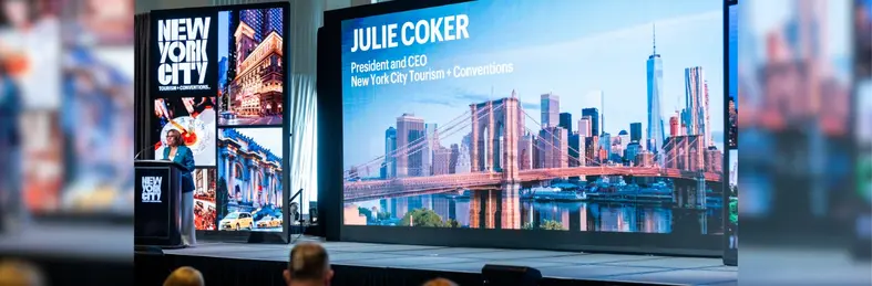 Julie Coker, CEO of NYC Tourism + Conventions, on stage at IPW 2025 in Chicago.