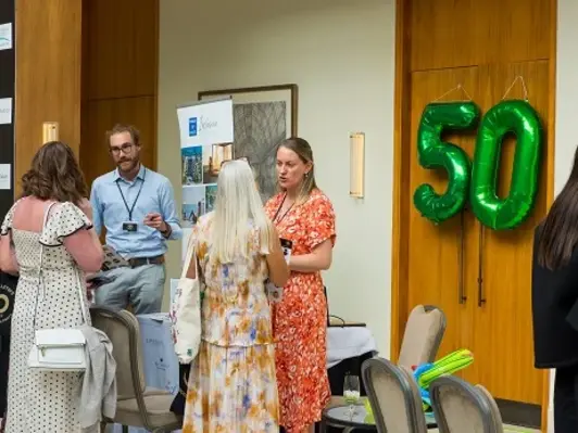 Alice Otton, representing Hyatt's Inclusive Collection, networking with travel agents at Travel Bulletin's 50th anniversary party.,