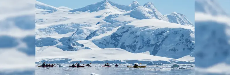 kayakers in the waters of Antarctica