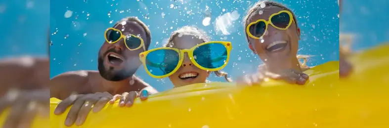 A mum, dad and child on a limo with sunglasses on