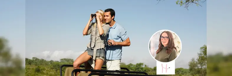 A couple holding binoculars on a jeep on safari during their honeymoon, overlaid with Sarah Doe's headshot and The Honeymoon Fixer logo.