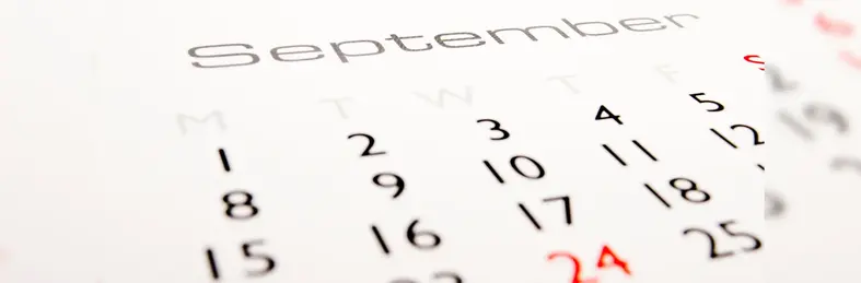 A 2025 calendar open on the September page.
