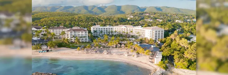 Landscape of the Hyatt Zilara Rose Hall, set against a lush green backdrop of vegetation